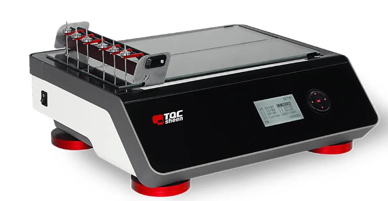 A TQC Sheen drying time recorder — a benchtop instrument with six needle holders travelling slowly over glass test strips