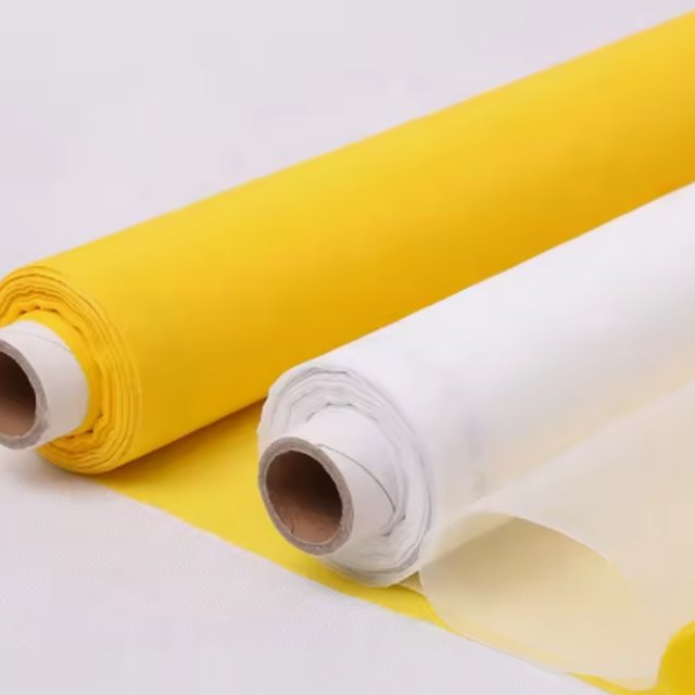 Rolls of polyester monofilament screen printing mesh in yellow and white